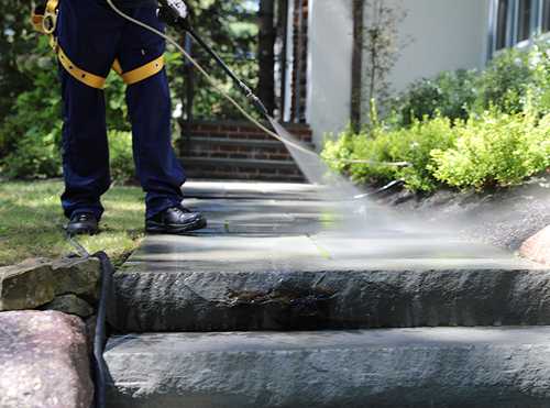 man on cleaning a walkway